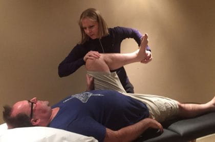 Jennifer Johnson working on a patient at her clinic