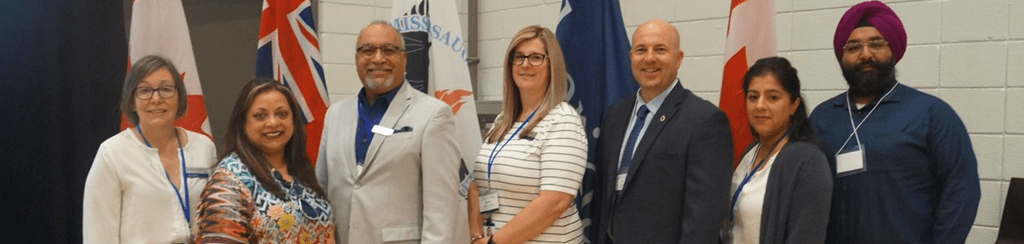 Sheridan VP, External Relations Christine Szustaczek stands beside organizers of Sheridan's Improving the international Student Experience Summit