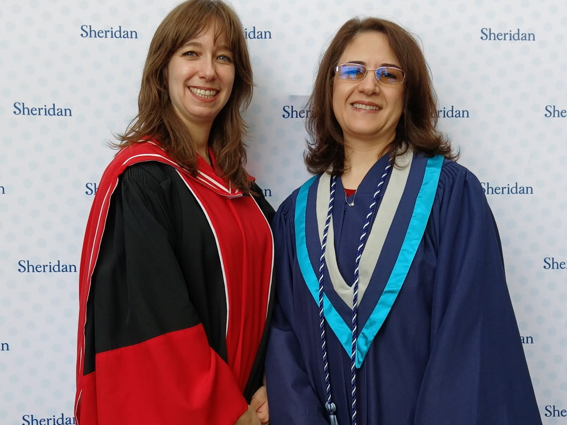 FHASS Dean Genevieve Amaral and valedictorian Asmaa Al Refai