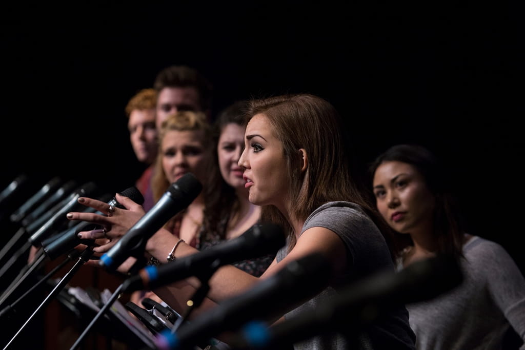Students performing in front of microphones at the Sheridan CMTP Festival of New Musicals