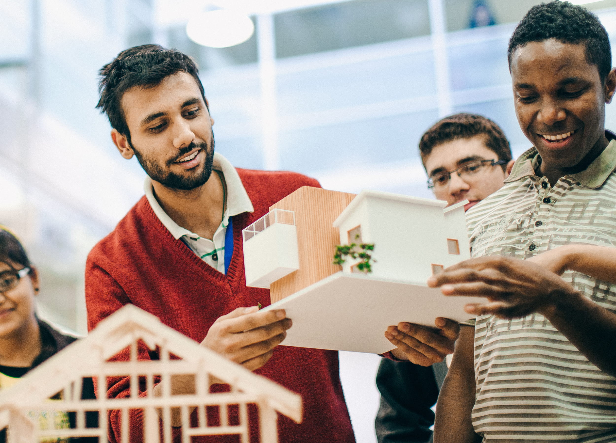 Architectural Technician/Technology students with a model of a house