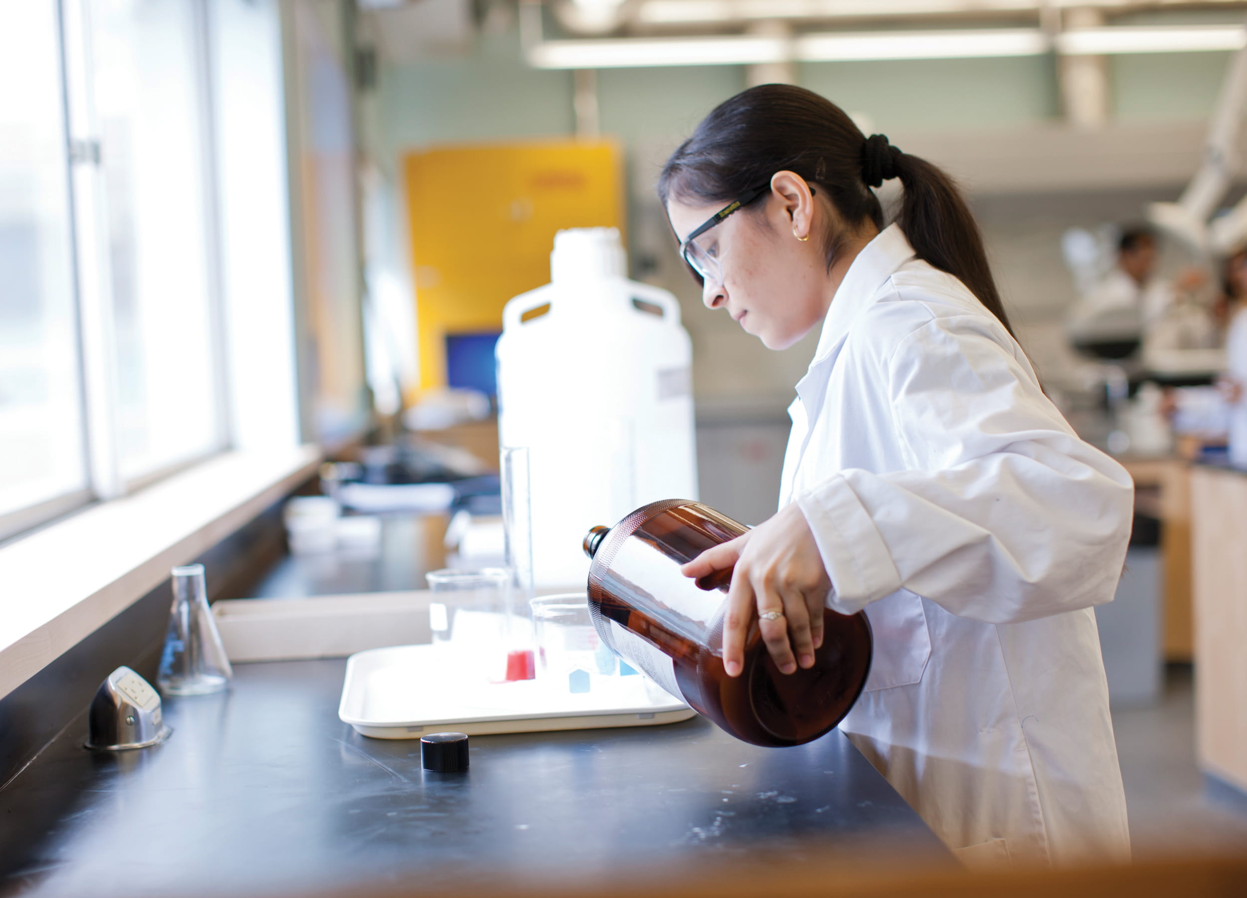 Environmental Control student mixing chemicals
