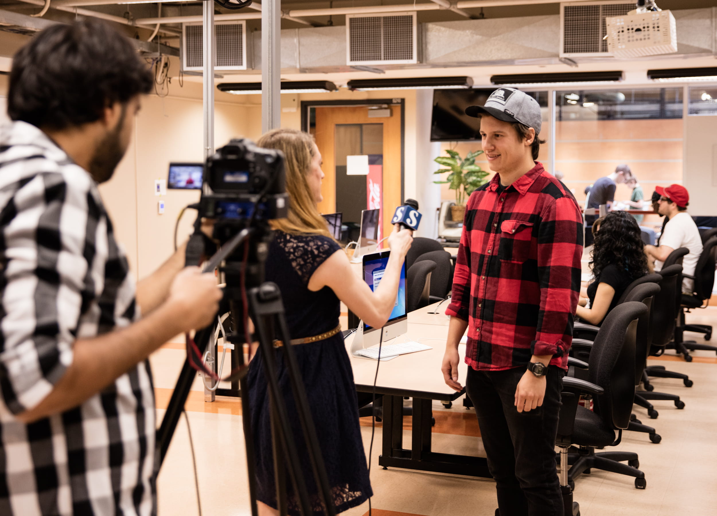 Journalism student conducting TV interview