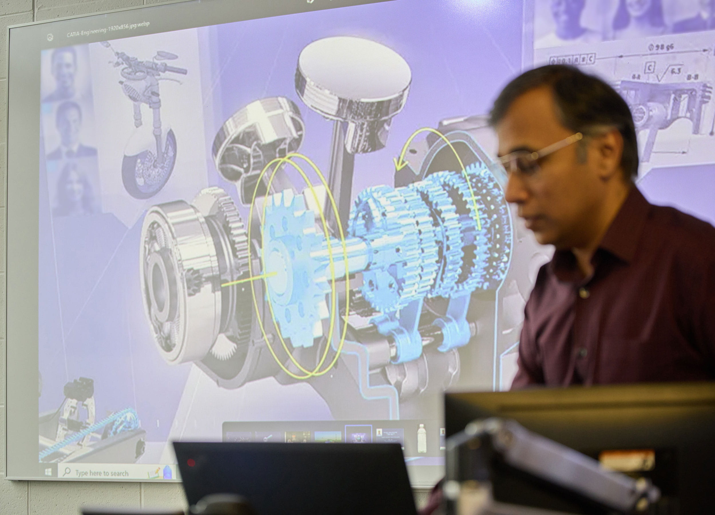 Mechanical engineering student presenting a design in a classroom