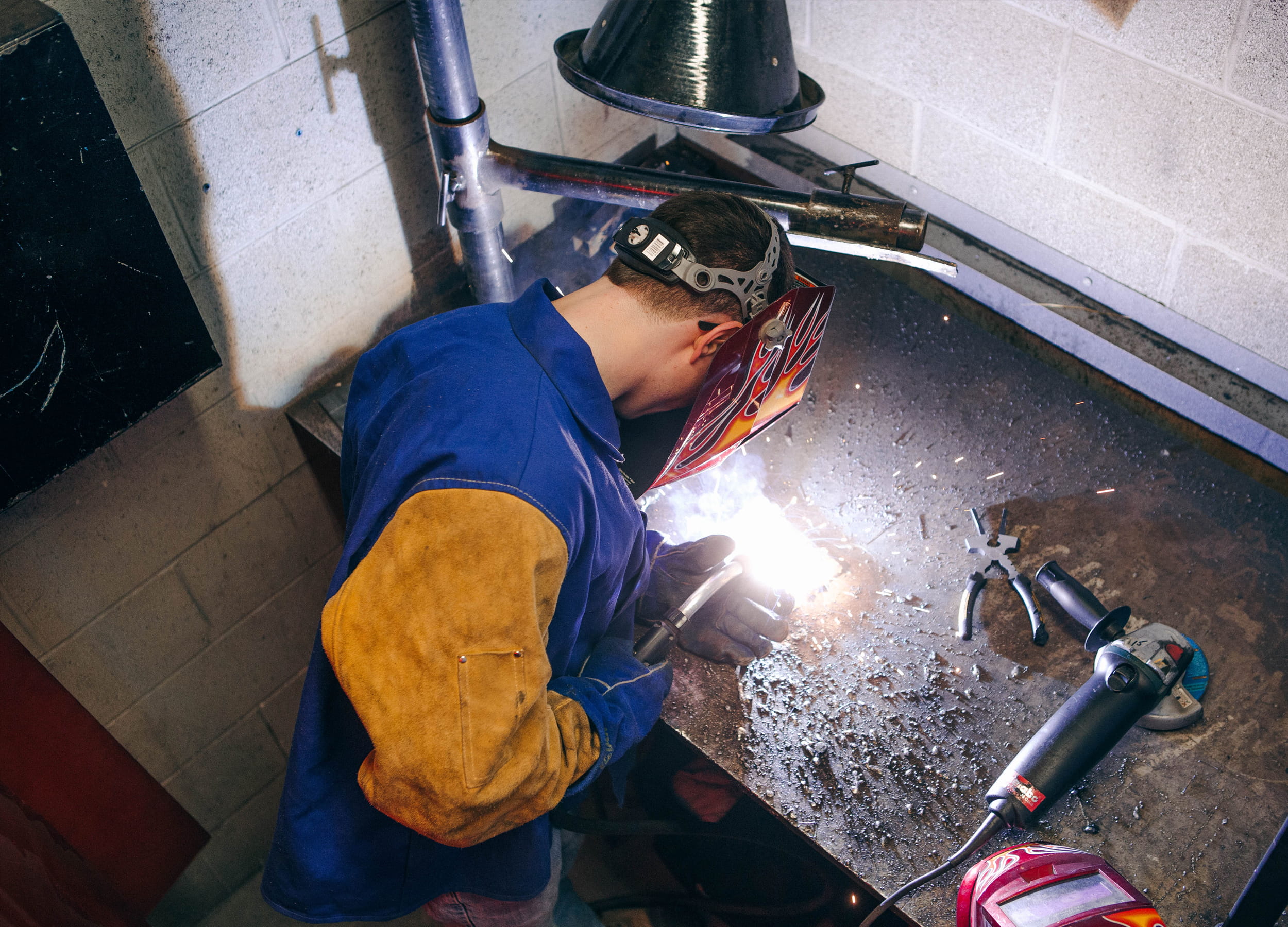 Welding techniques student working in a lab