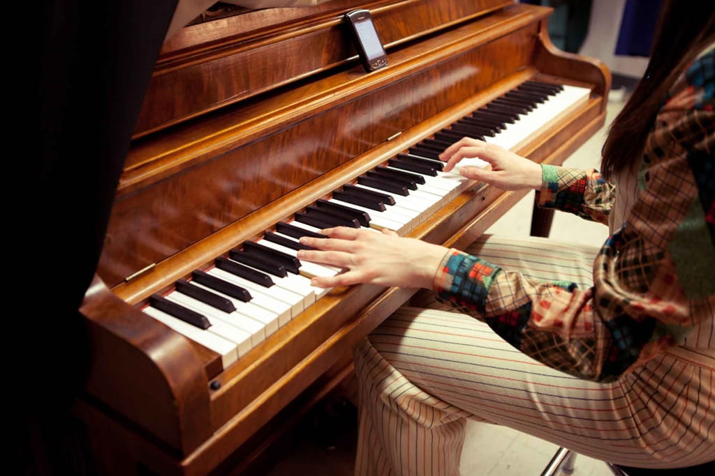 A student playing the piano